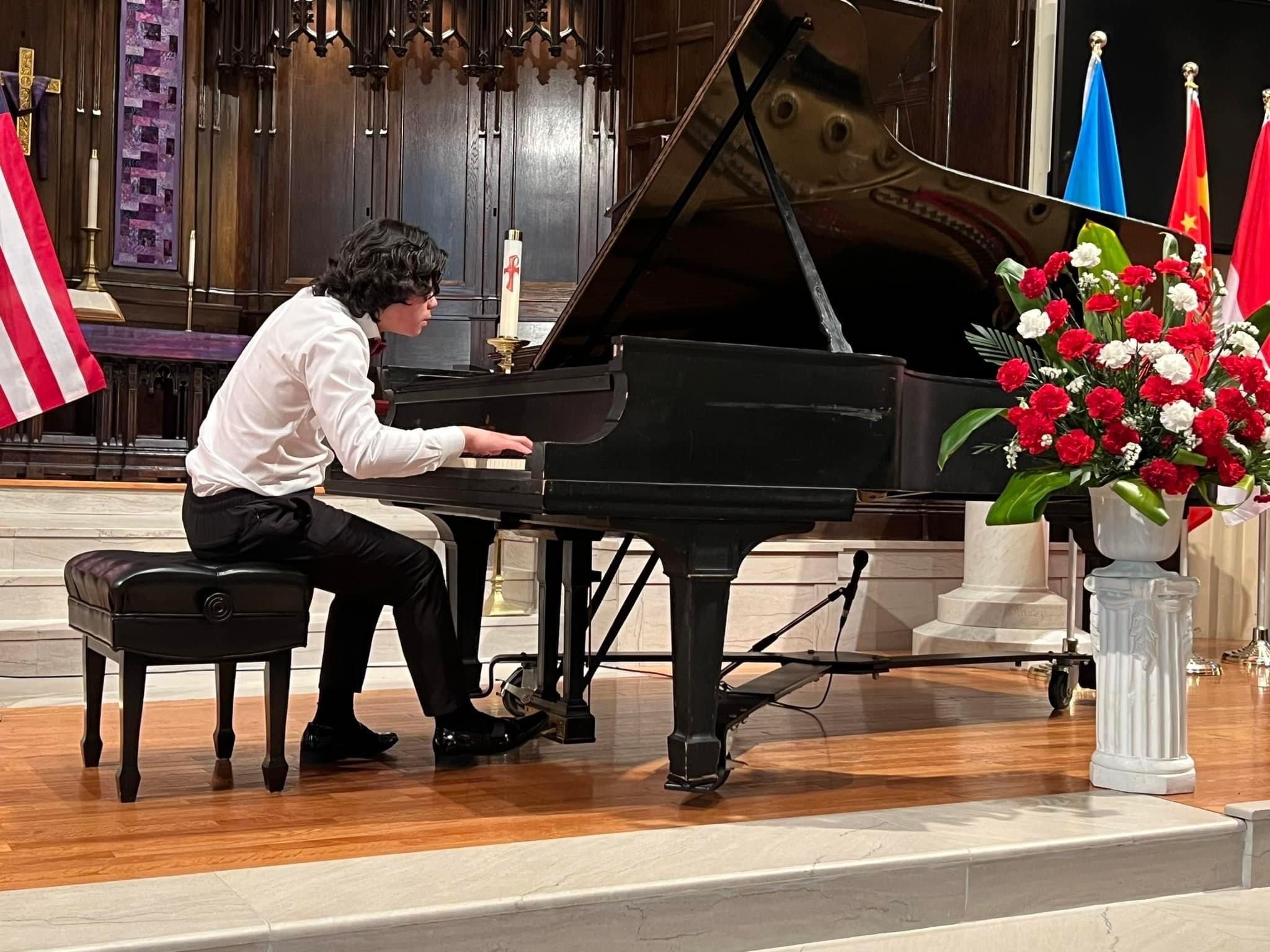Norman Lu performing at the piano